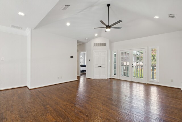 unfurnished living room with dark wood-type flooring, vaulted ceiling, french doors, and ceiling fan