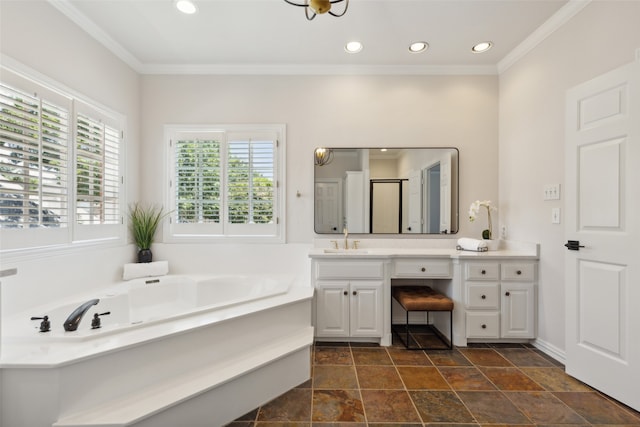 bathroom with crown molding, a tub, and vanity