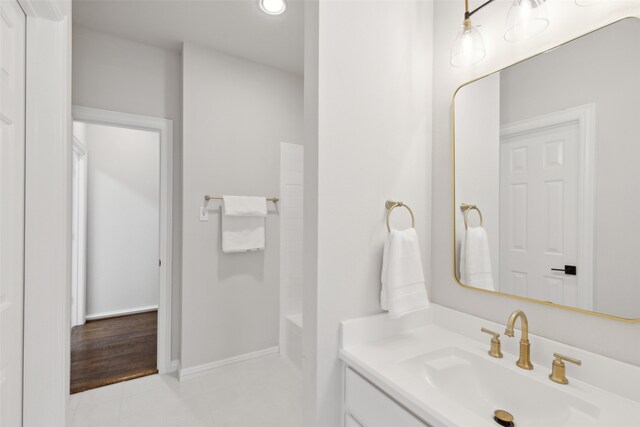 bathroom with hardwood / wood-style floors and vanity