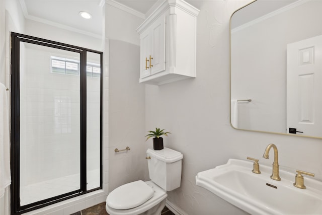 bathroom featuring toilet, an enclosed shower, ornamental molding, and sink