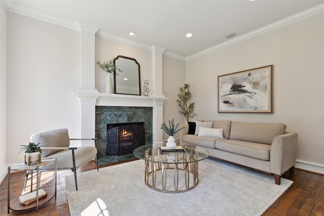 living room featuring crown molding, dark hardwood / wood-style flooring, and a high end fireplace