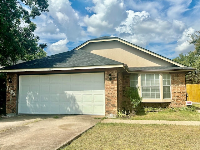 ranch-style house with a garage and a front lawn