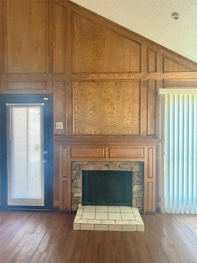 details with wood-type flooring, radiator, and wood walls