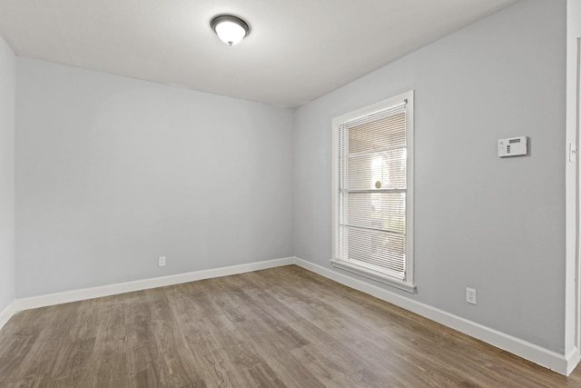 empty room with wood-type flooring