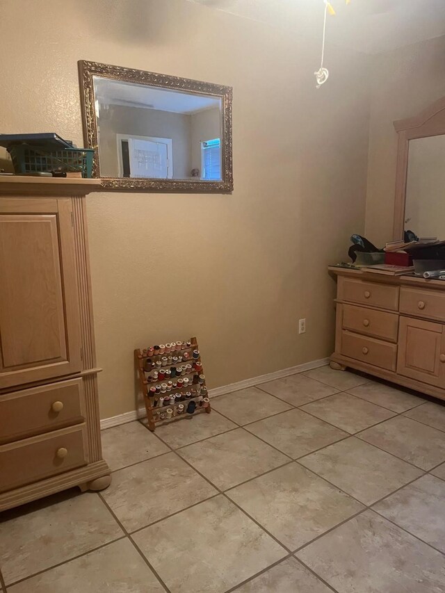 bedroom featuring light tile patterned floors