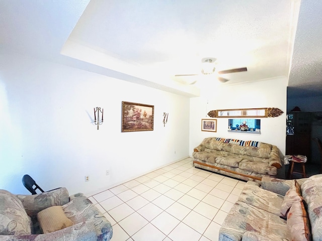 tiled living room featuring ceiling fan