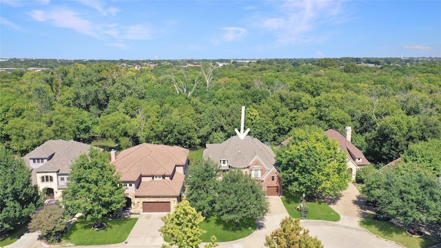 aerial view featuring a forest view