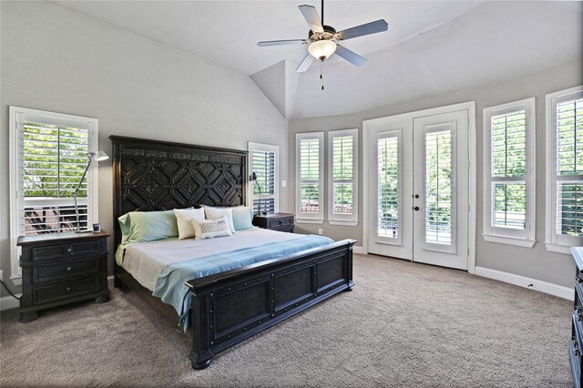 carpeted bedroom featuring access to outside, high vaulted ceiling, multiple windows, and ceiling fan