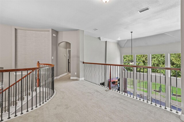 corridor with carpet flooring