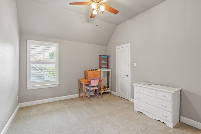 interior space with ceiling fan and vaulted ceiling