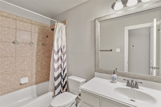 full bathroom featuring shower / bath combo, toilet, and vanity