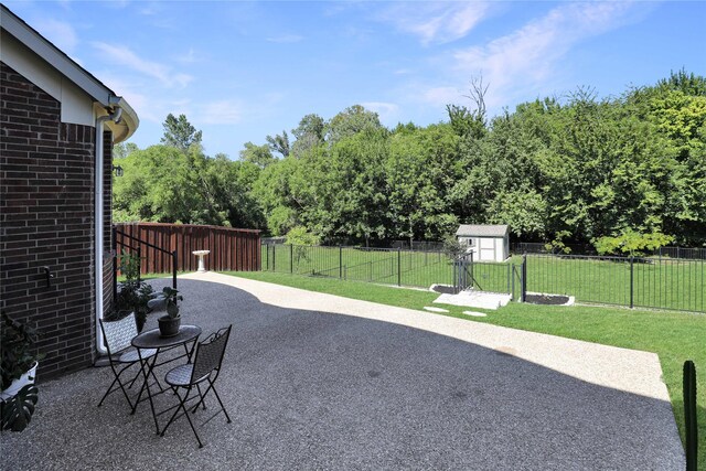 view of patio / terrace with a shed