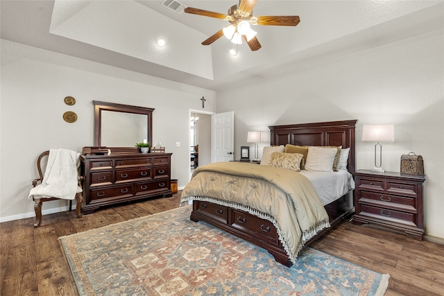 bedroom featuring vaulted ceiling, ceiling fan, and dark hardwood / wood-style floors