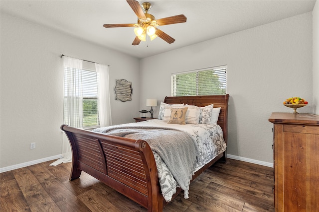 bedroom featuring ceiling fan and dark hardwood / wood-style floors