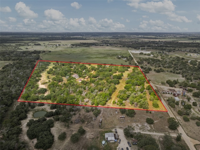 birds eye view of property with a rural view