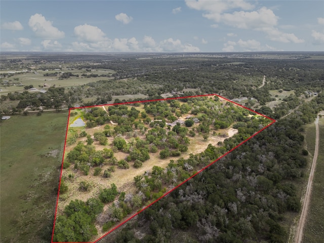 birds eye view of property featuring a rural view