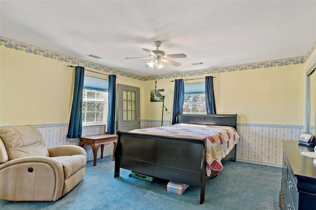 bedroom with ceiling fan and carpet floors