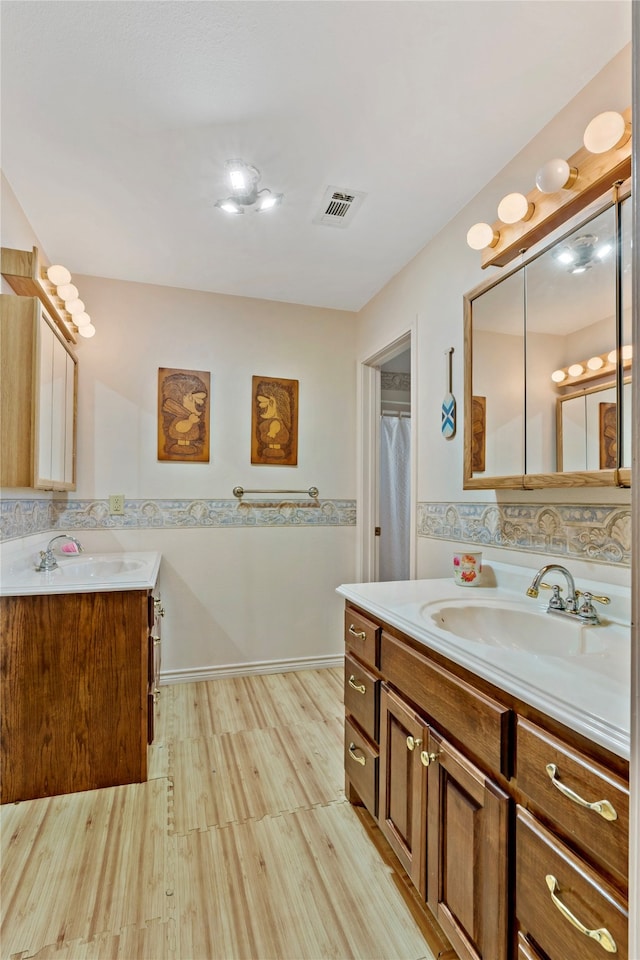 bathroom featuring wood-type flooring and vanity