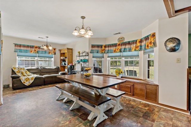 dining area with a notable chandelier