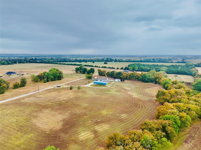 birds eye view of property featuring a rural view