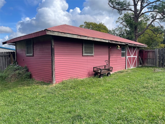 view of side of home featuring a lawn