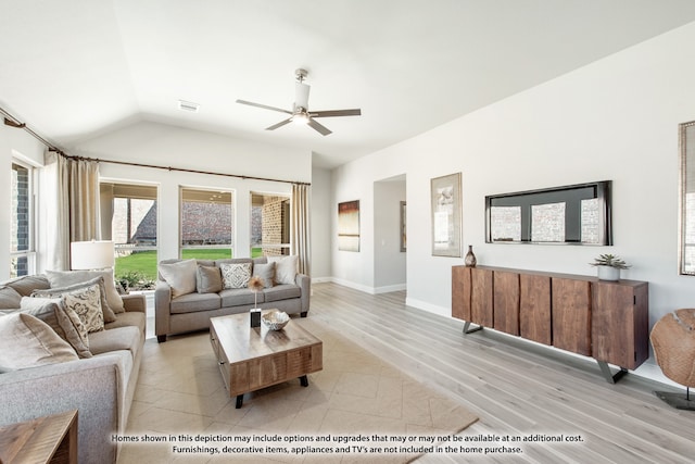 tiled living room featuring ceiling fan and vaulted ceiling