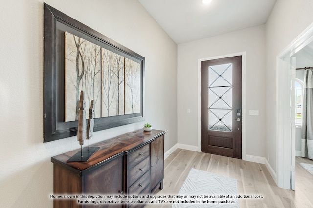 entryway with light hardwood / wood-style flooring