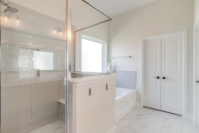 bathroom with separate shower and tub