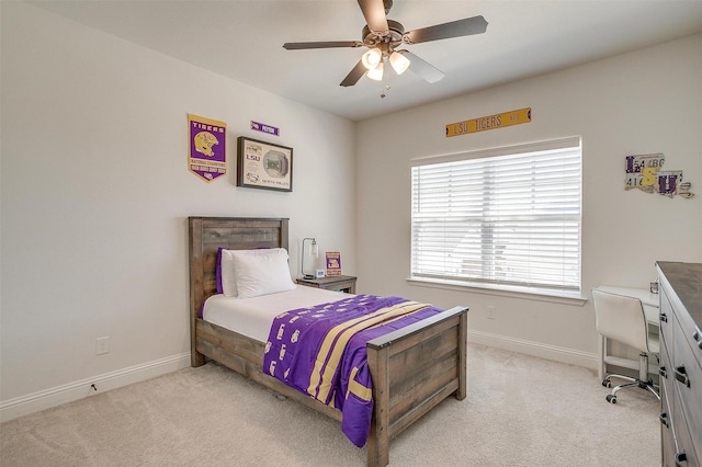 carpeted bedroom with ceiling fan