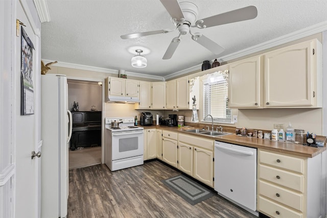 kitchen with crown molding, white appliances, a sink, and under cabinet range hood