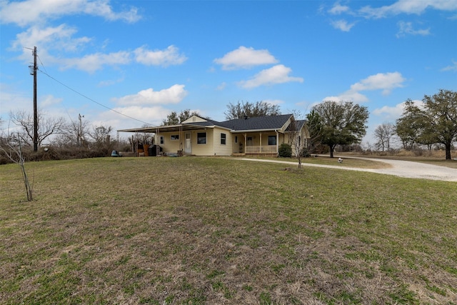 single story home with a porch and a front yard