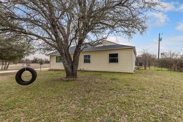 view of home's exterior featuring a yard