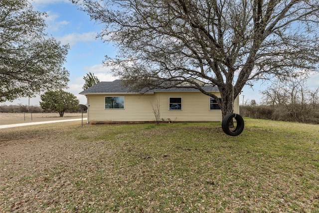 view of home's exterior with a yard