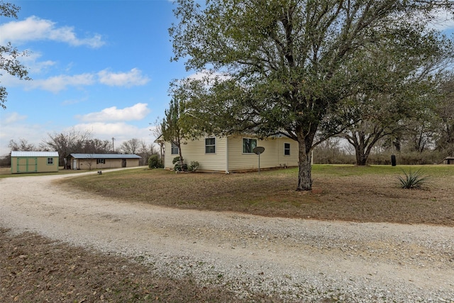 exterior space with dirt driveway