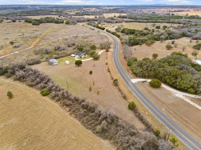 birds eye view of property with a rural view