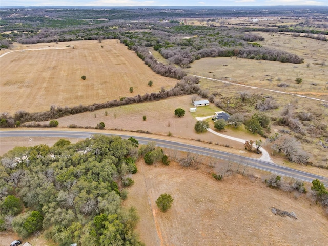 birds eye view of property with a rural view