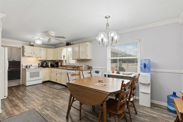 dining space with a wainscoted wall, dark wood finished floors, and crown molding