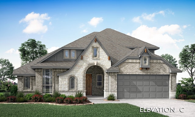 view of front of house with a front yard and a garage