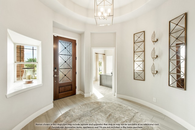 foyer featuring a chandelier and light hardwood / wood-style floors