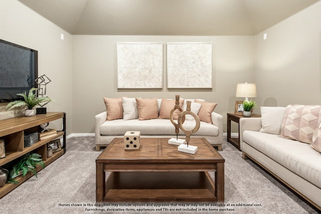 living room featuring vaulted ceiling and carpet floors