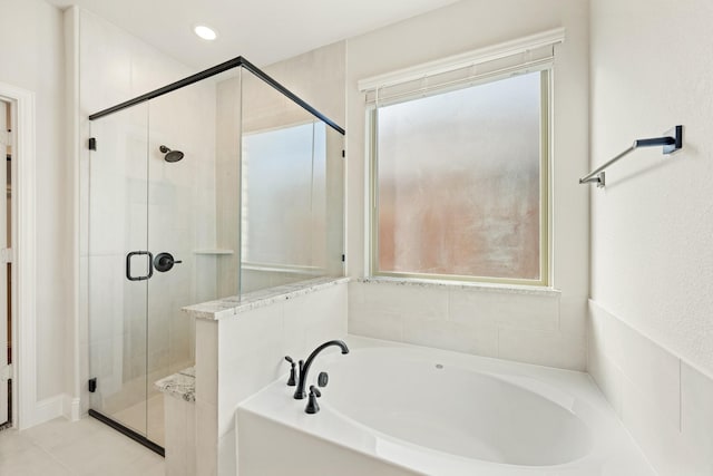 bathroom with plus walk in shower and a wealth of natural light