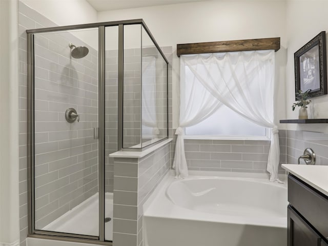 bathroom with independent shower and bath and vanity