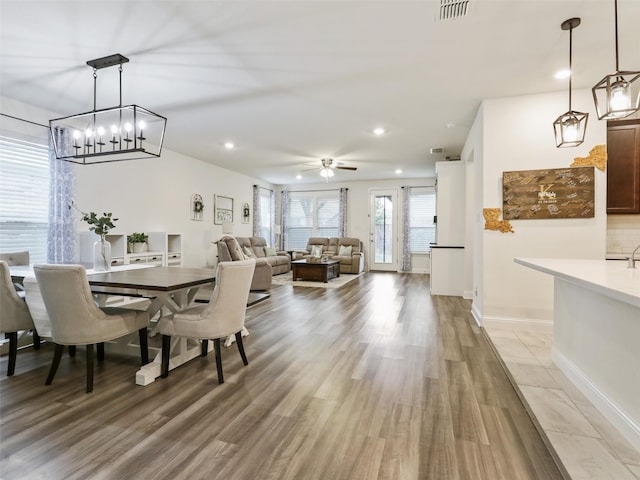 dining space featuring hardwood / wood-style floors and ceiling fan