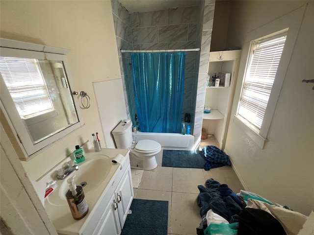 full bathroom featuring vanity, toilet, tile patterned floors, and shower / bath combo