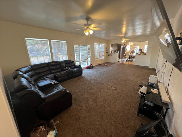 living room with ceiling fan and carpet floors