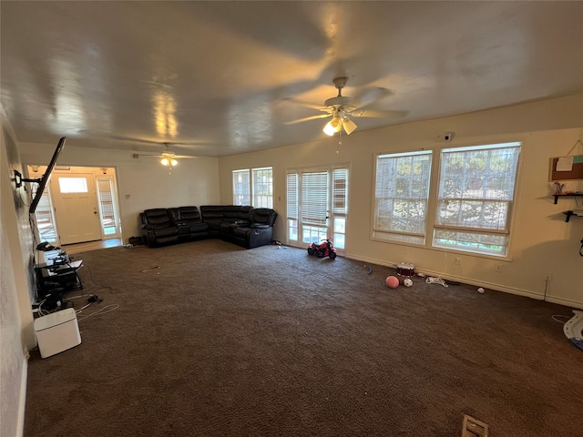 carpeted living room with ceiling fan