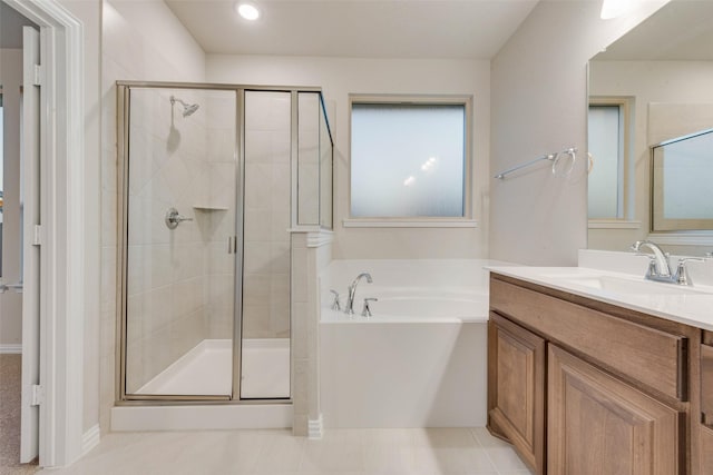 bathroom featuring vanity, plus walk in shower, and tile patterned flooring