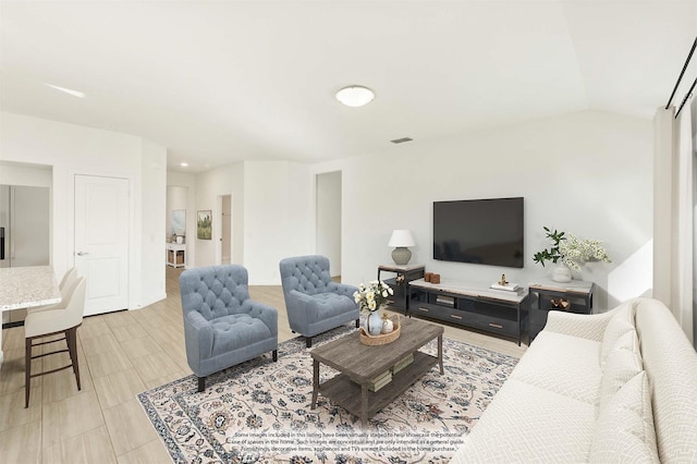 living room with vaulted ceiling