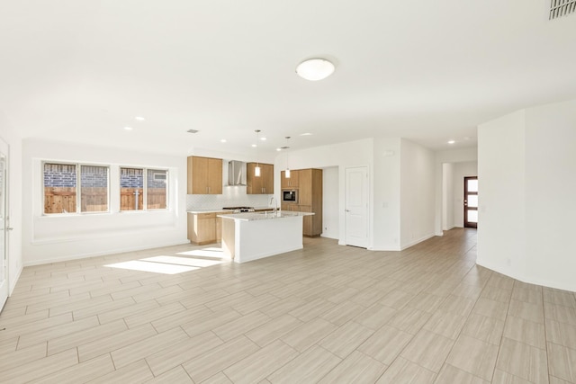 unfurnished living room featuring sink