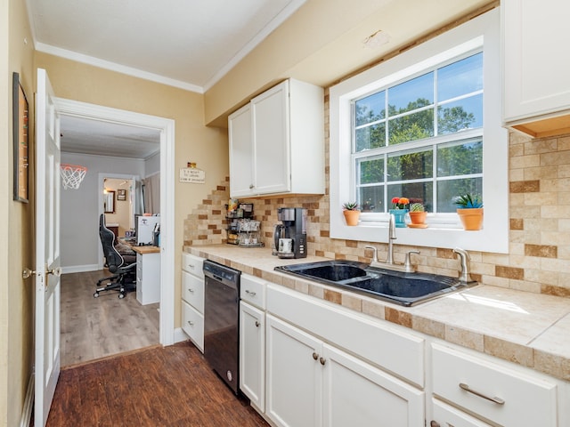 kitchen with dark hardwood / wood-style floors, dishwasher, sink, decorative backsplash, and white cabinets